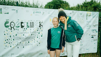 With the AMR Technology Campus just around the corner in Silverstone, the children showed their support for our team with a vibrant banner displaying images they had drawn.
