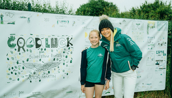 With the AMR Technology Campus just around the corner in Silverstone, the children showed their support for our team with a vibrant banner displaying images they had drawn.