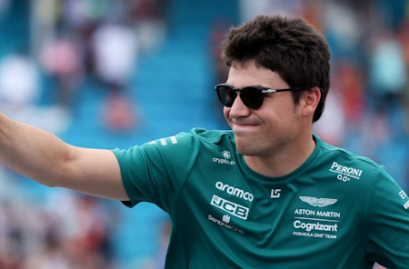Thumbs up: Lance waves to the crowd in Sunday's driver parade