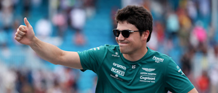 Thumbs up: Lance waves to the crowd in Sunday's driver parade