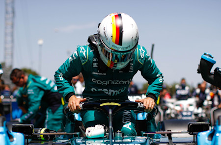 Ready to race: Sebastian climbs into the car ahead of the Spanish Grand Prix