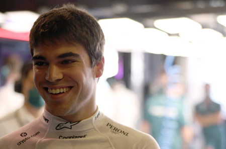 All smiles: Lance takes a moment before he climbs into the AMR21 for Friday practice