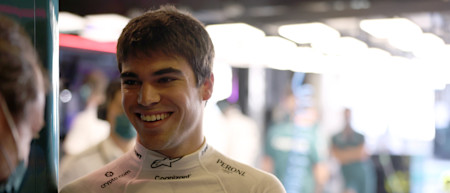 All smiles: Lance takes a moment before he climbs into the AMR21 for Friday practice