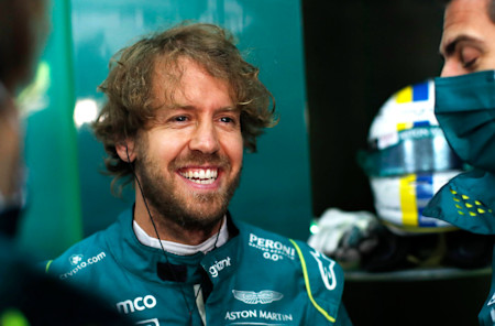 Sebastian is all smiles before climbing into the AMR22