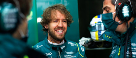 Sebastian is all smiles before climbing into the AMR22