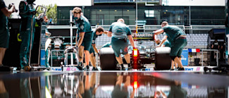 Seeing double: Mechanics bring the AMR21 into the garage