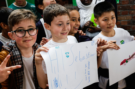 Students greeted Sebastian and were excited to share their F1 drawings