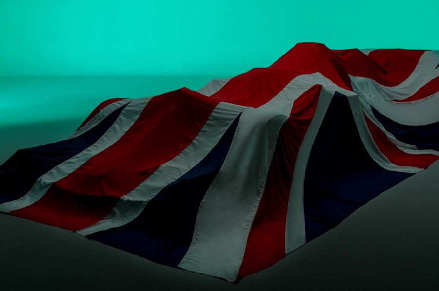 The moment draws near as the AMR21 awaits its launch from under the British flag covers