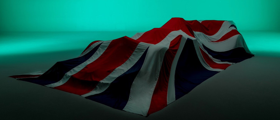 The moment draws near as the AMR21 awaits its launch from under the British flag covers