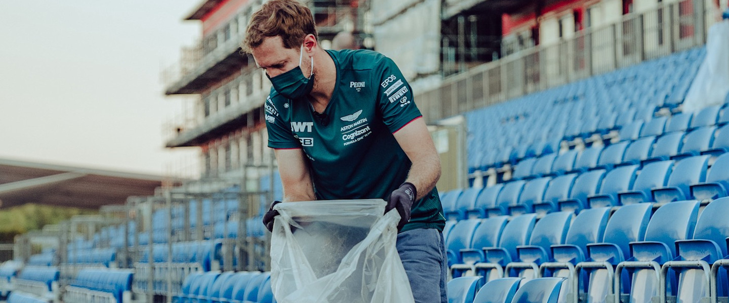 Sebastian picks up litter following the British Grand Prix