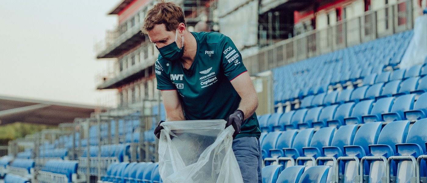Sebastian picks up litter following the British Grand Prix