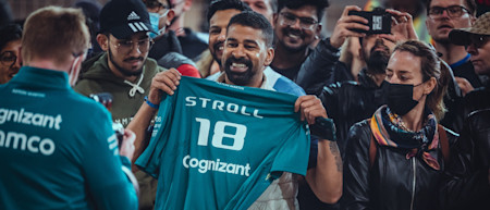 Lance signs team merchandise for a fan in Bahrain