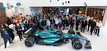 One for the photo album. Students gathered by our F1 car for a memorable photo after seeing the car up close. 