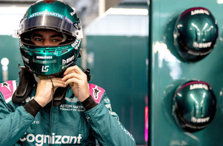 Suited and booted: Lance gets ready to jump into the AMR21