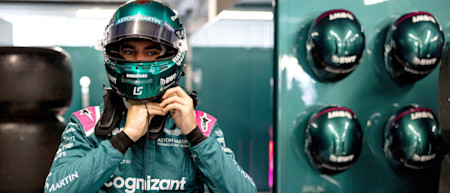 Suited and booted: Lance gets ready to jump into the AMR21