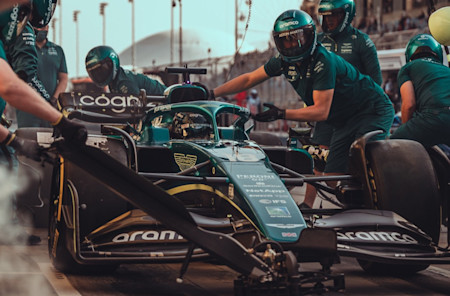 Practice pitstop as dusk falls at the Bahrain International Circuit