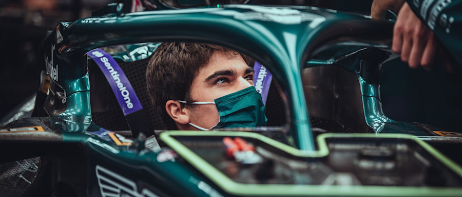 All smiles as Lance works with the crew to get his AMR21 set up for the weekend.