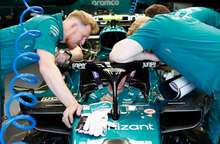 The AMF1 team work on Sebastian's car ahead of FP1