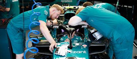The AMF1 team work on Sebastian's car ahead of FP1