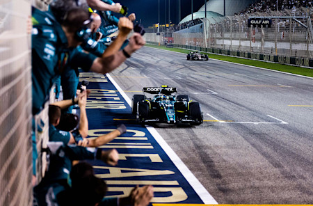 The team effort. Fernando celebrates with the team after crossing the finish line.