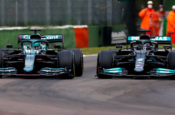 Lance draws alongside a Mercedes into Tamburello