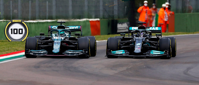 Lance draws alongside a Mercedes into Tamburello