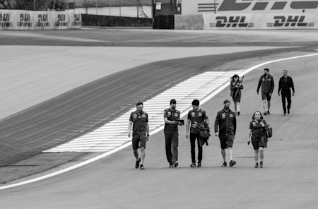 Lance Stroll and his team do a track walk