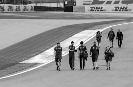 Lance Stroll and his team do a track walk
