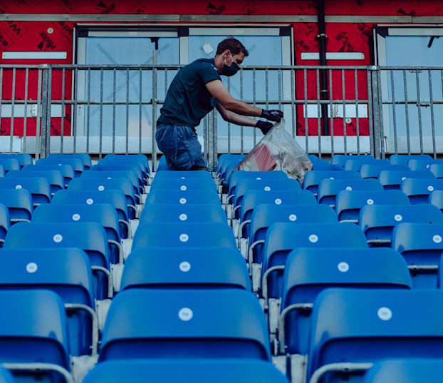 Sebastian picks up litter following the British Grand Prix