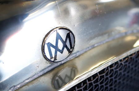 The original Aston Martin logo above the grille of the Green Pea.